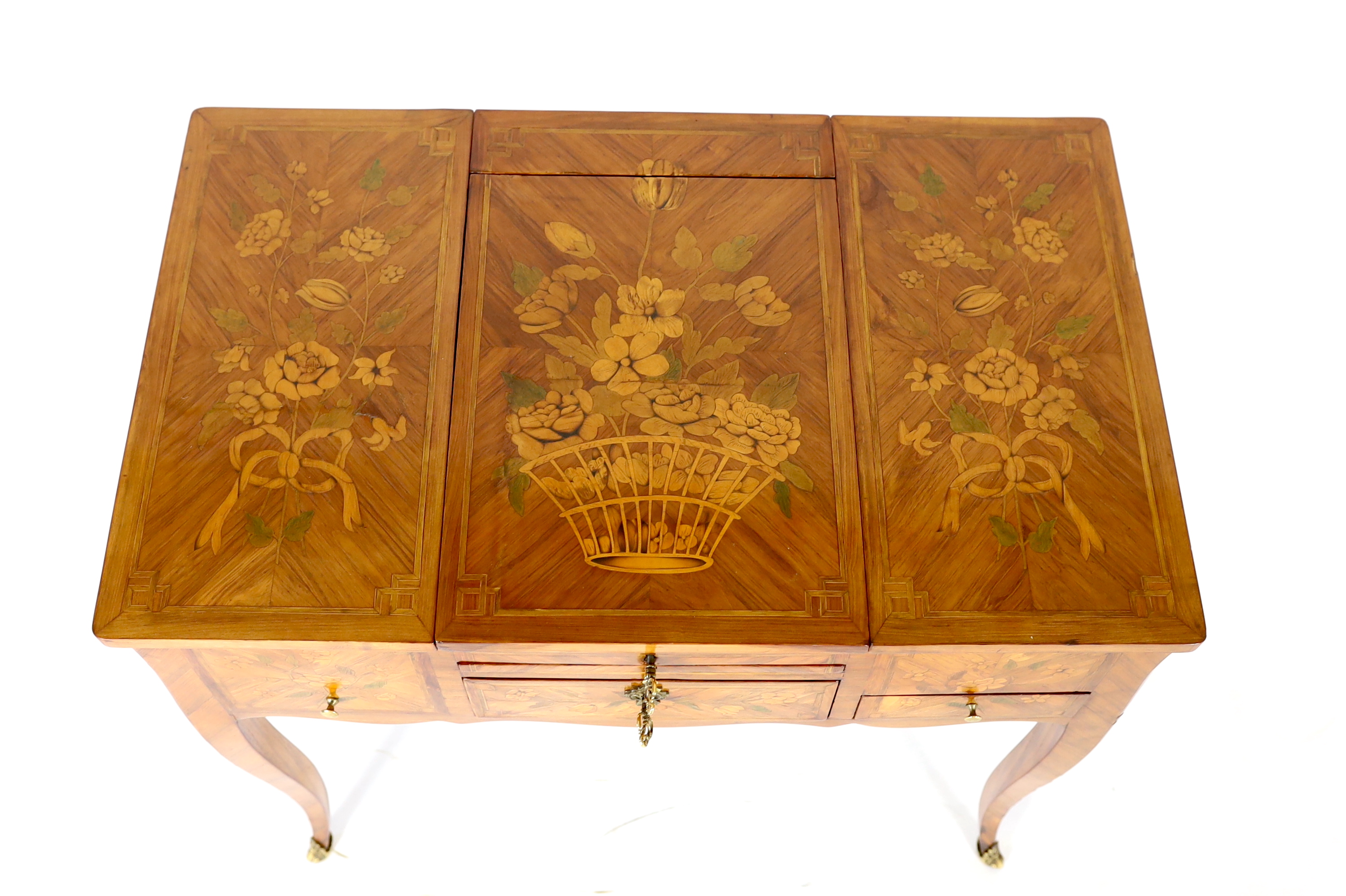 A Louis XV marquetry inlaid kingwood poudreuse, 76cm wide, 46.5cm deep, 71cm high, Please note this lot attracts an additional import tax of 5% on the hammer price